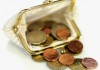 Close-up of euro coins spilling out of change purse